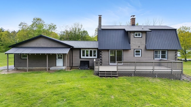 753 Sanborn Rd, Sanbornton, NH 03269 - rear view of property with a lawn, a chimney, metal roof, and a deck