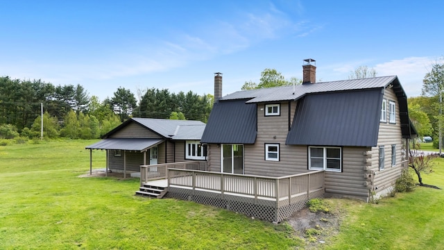 753 Sanborn Rd, Sanbornton, NH 03269 - back of property featuring a chimney, a yard, a gambrel roof, metal roof, and a deck