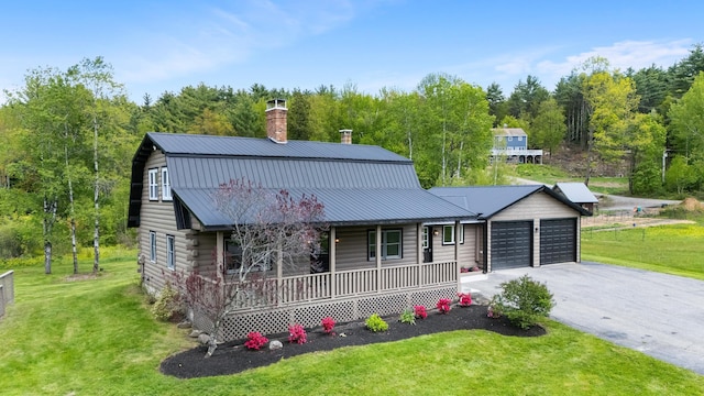 753 Sanborn Rd, Sanbornton, NH 03269 - view of front of home with covered porch, a garage, a front yard, driveway, and a chimney