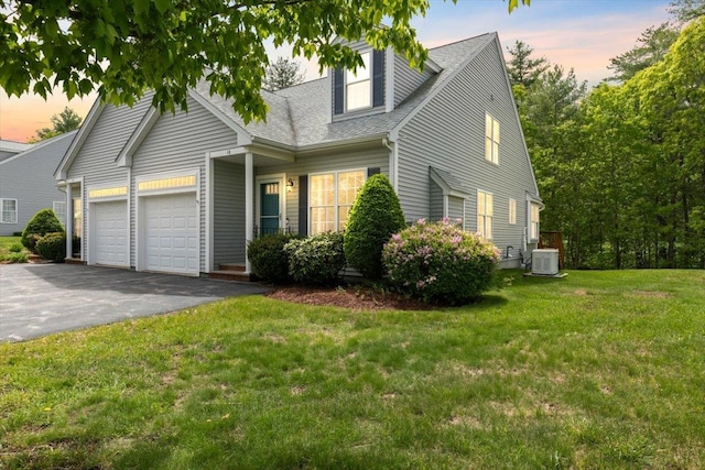 10 Hadleigh Rd, Windham, NH 03087 - cape cod home featuring driveway, an attached garage, cooling unit, a shingled roof, and a lawn