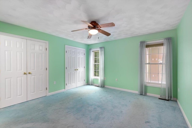 10 Hadleigh Rd, Windham, NH 03087 - unfurnished bedroom featuring multiple windows, baseboards, and multiple closets