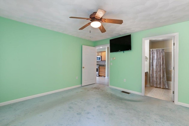 10 Hadleigh Rd, Windham, NH 03087 - unfurnished bedroom with light carpet, baseboards, a ceiling fan, and ensuite bathroom