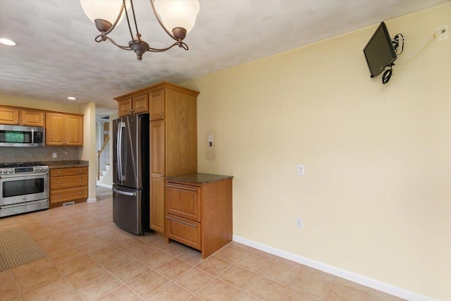 10 Hadleigh Rd, Windham, NH 03087 - kitchen with appliances with stainless steel finishes, decorative backsplash, a chandelier, baseboards, and recessed lighting