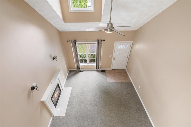 10 Hadleigh Rd, Windham, NH 03087 - carpeted foyer entrance with baseboards, a ceiling fan, and a glass covered fireplace