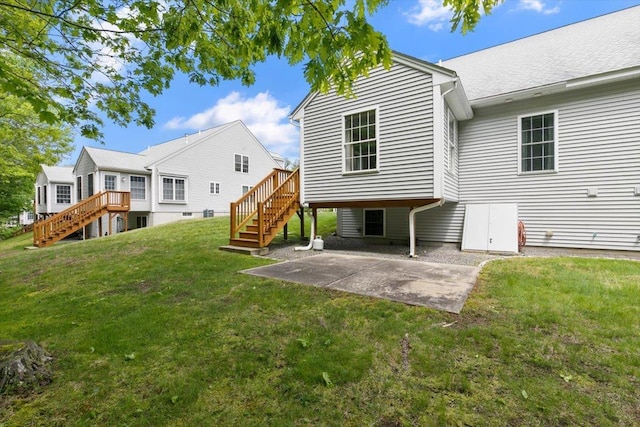 10 Hadleigh Rd, Windham, NH 03087 - back of property with stairs, a lawn, a patio, and a deck