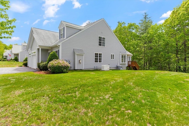 10 Hadleigh Rd, Windham, NH 03087 - view of property exterior featuring driveway, a yard, a garage, and central AC unit