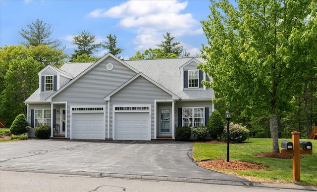 10 Hadleigh Rd, Windham, NH 03087 - cape cod-style house featuring asphalt driveway, a garage, a front yard, and roof with shingles