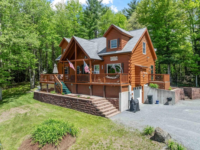 57 Westview Dr Unit 41 40, Haverhill, NH 03785 - log cabin featuring a wooden deck, stairs, gravel driveway, a shingled roof, and a front yard