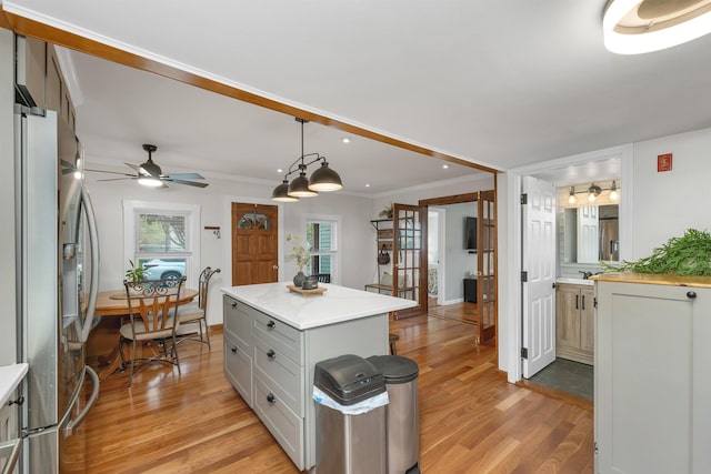 47 Foch St, Manchester, NH 03104 - kitchen with stainless steel refrigerator with ice dispenser, light countertops, light wood-style flooring, recessed lighting, and a ceiling fan