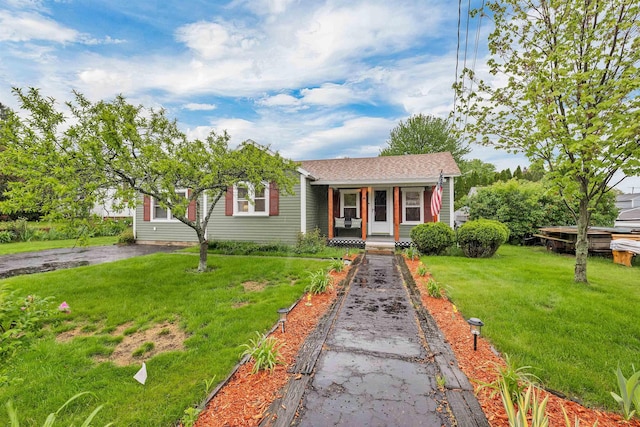 47 Foch St, Manchester, NH 03104 - view of front of home featuring a porch and a front lawn