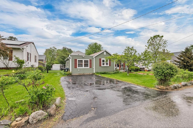 47 Foch St, Manchester, NH 03104 - view of front of house featuring driveway and a front yard