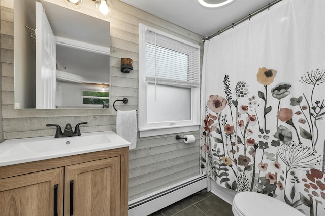 47 Foch St, Manchester, NH 03104 - full bathroom featuring a baseboard radiator, tile patterned flooring, vanity, toilet, and a shower with curtain