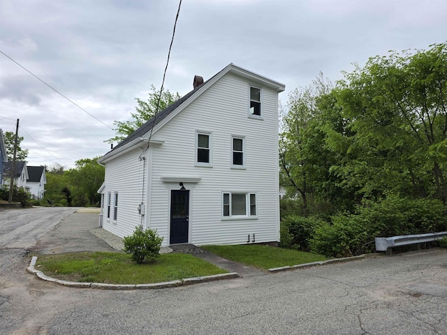 11 Bunker St, Farmington, NH 03835 - view of front of home featuring a chimney