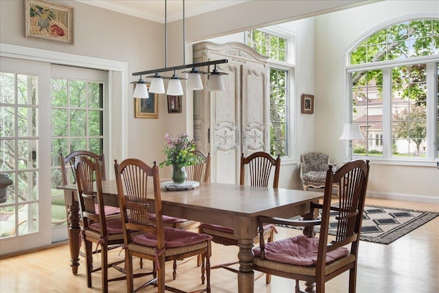 26 Pinnacle Dr, South Burlington, VT 05403 - dining space featuring light wood-style flooring, crown molding, and baseboards