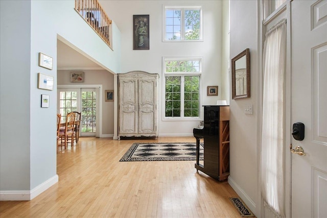 26 Pinnacle Dr, South Burlington, VT 05403 - foyer featuring light wood-type flooring, a high ceiling, and baseboards