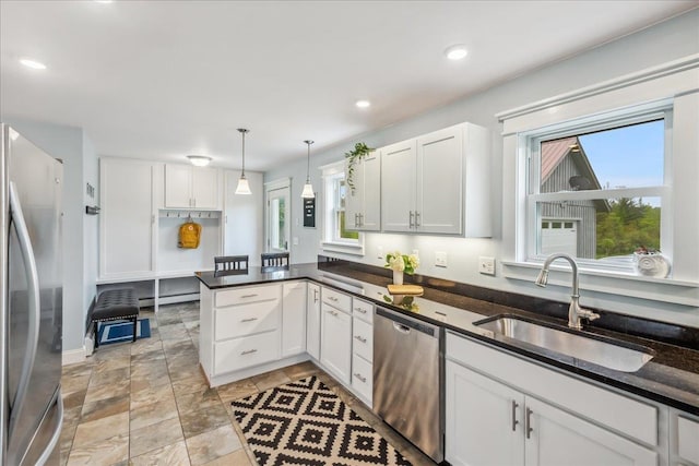3352 Watertower Rd, Berkshire, VT 05450 - kitchen with appliances with stainless steel finishes, a sink, a baseboard radiator, white cabinetry, and recessed lighting