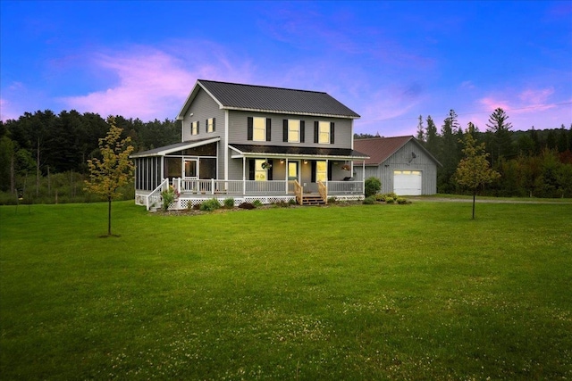 3352 Watertower Rd, Berkshire, VT 05450 - view of front facade featuring a porch, a yard, a sunroom, and a detached garage
