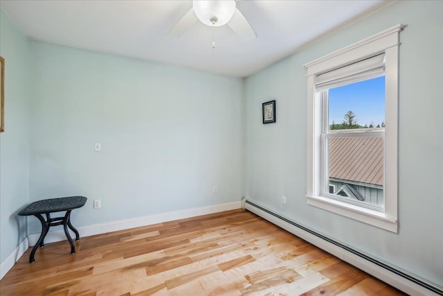 3352 Watertower Rd, Berkshire, VT 05450 - spare room with baseboard heating, light wood-type flooring, a ceiling fan, and baseboards