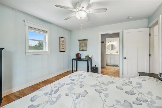 3352 Watertower Rd, Berkshire, VT 05450 - bedroom with wood finished floors, baseboards, a ceiling fan, and connected bathroom