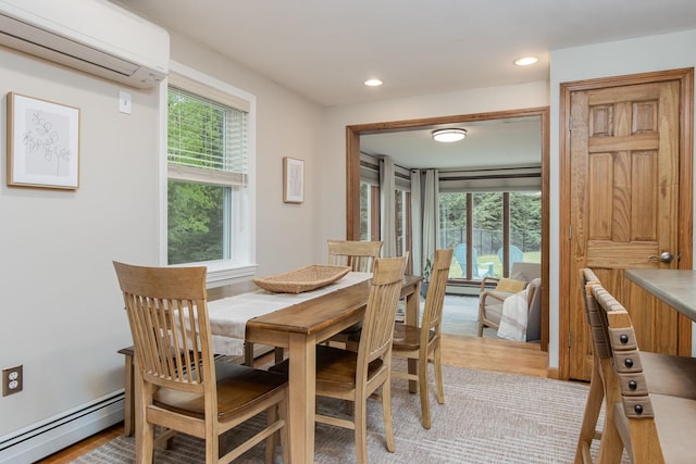 27 Grafton Dr, Bedford, NH 03110 - dining space featuring a baseboard radiator, a wall mounted air conditioner, light wood-style flooring, and recessed lighting