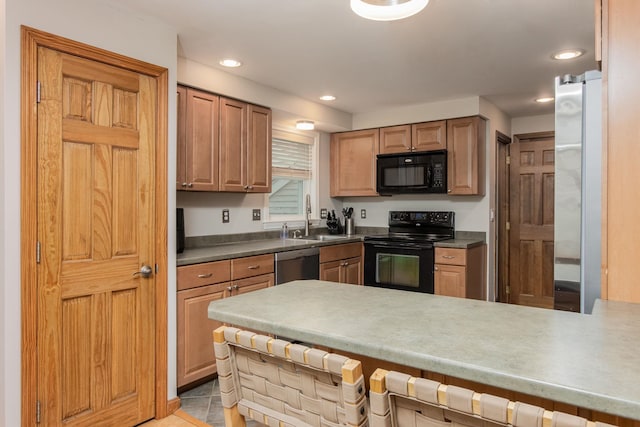 27 Grafton Dr, Bedford, NH 03110 - kitchen featuring black appliances, a sink, a kitchen breakfast bar, a peninsula, and recessed lighting