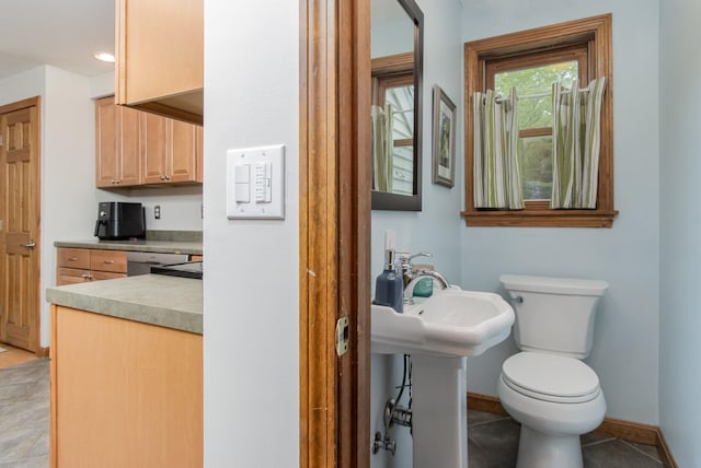 27 Grafton Dr, Bedford, NH 03110 - bathroom with toilet, baseboards, and tile patterned floors