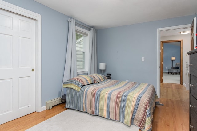 27 Grafton Dr, Bedford, NH 03110 - bedroom with baseboard heating and wood finished floors