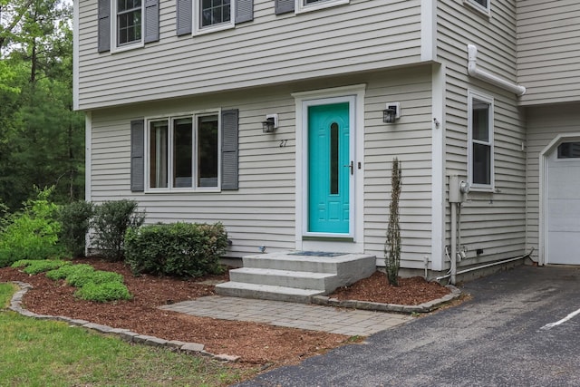 27 Grafton Dr, Bedford, NH 03110 - view of exterior entry featuring a garage