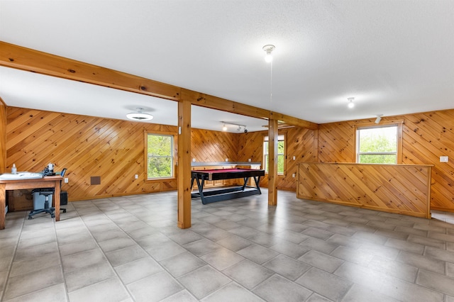 174 Sky View Rd, Stratford, NH 03590 - game room featuring wood walls, a desk, and beamed ceiling