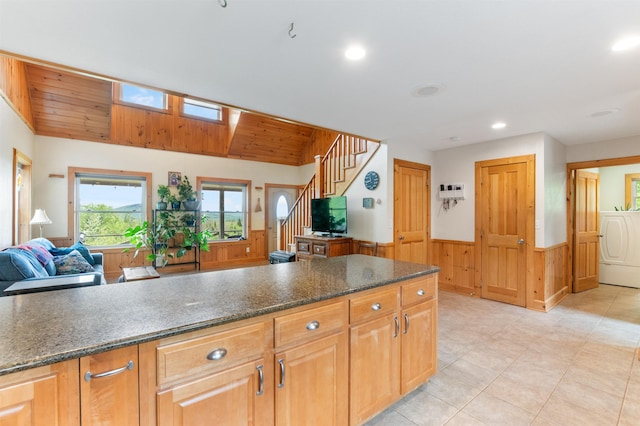 174 Sky View Rd, Stratford, NH 03590 - kitchen with wainscoting, washer / dryer, dark stone countertops, open floor plan, and recessed lighting