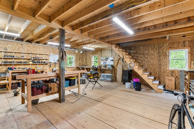 174 Sky View Rd, Stratford, NH 03590 - below grade area featuring a workshop area, hardwood / wood-style floors, and stairway