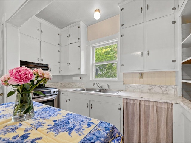 27 Ridge St, Montpelier, VT 05602 - kitchen with a sink, stainless steel gas stove, light countertops, and range hood