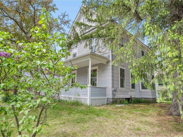 27 Ridge St, Montpelier, VT 05602 - view of side of home with covered porch and a lawn