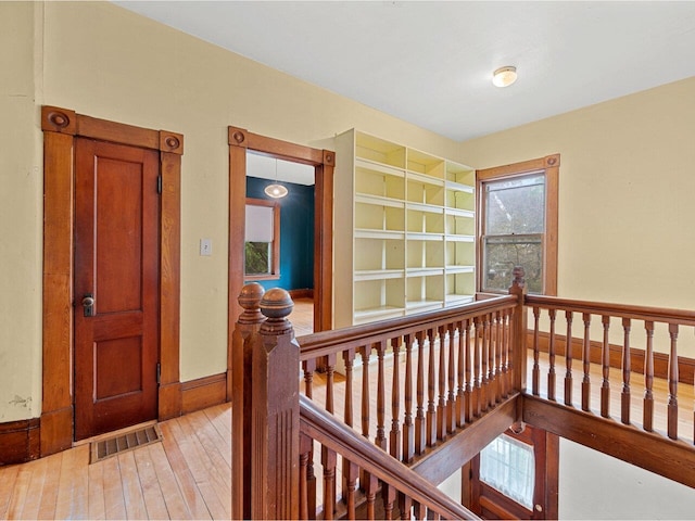 27 Ridge St, Montpelier, VT 05602 - corridor with an upstairs landing, light wood-style floors, built in features, and baseboards