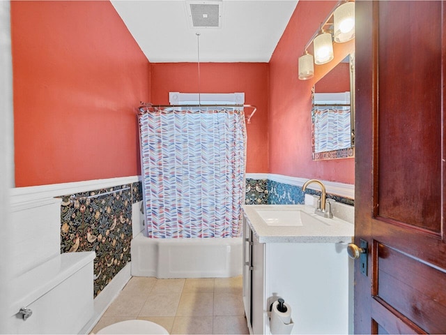 27 Ridge St, Montpelier, VT 05602 - full bathroom with toilet, a wainscoted wall, vanity, shower / bathtub combination with curtain, and tile patterned floors