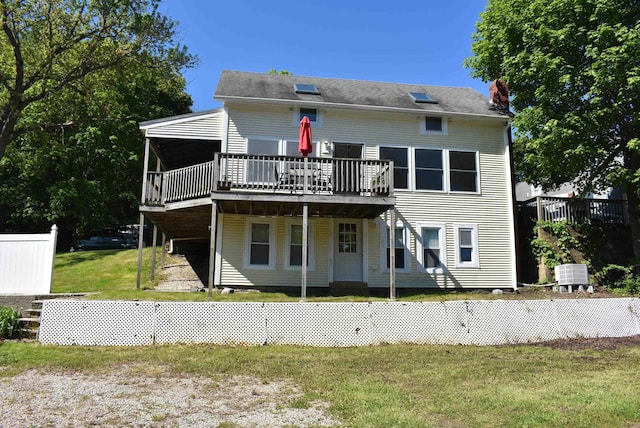 11 Creighton St, Newmarket, NH 03857 - back of house featuring a wooden deck, a yard, and a chimney