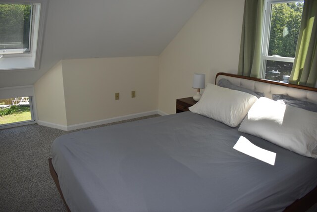 11 Creighton St, Newmarket, NH 03857 - bedroom with vaulted ceiling, carpet floors, and baseboards