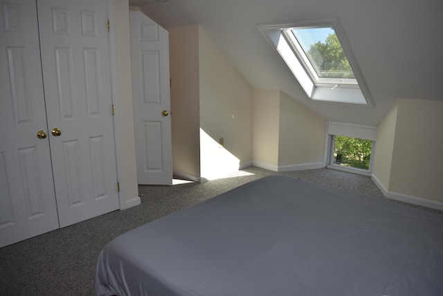 11 Creighton St, Newmarket, NH 03857 - unfurnished bedroom featuring a skylight, carpet, vaulted ceiling, and baseboards