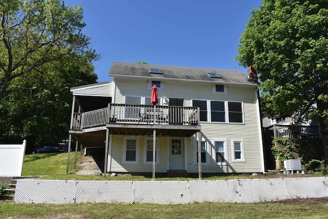 11 Creighton St, Newmarket, NH 03857 - back of property with a wooden deck, a yard, and a chimney