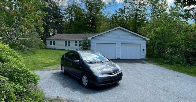 564 66th Rte, Randolph, VT 05060 - ranch-style house featuring an outbuilding, a detached garage, and a front lawn