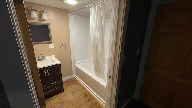 564 66th Rte, Randolph, VT 05060 - bathroom with wood finished floors, vanity, shower / bath combination with curtain, and baseboards
