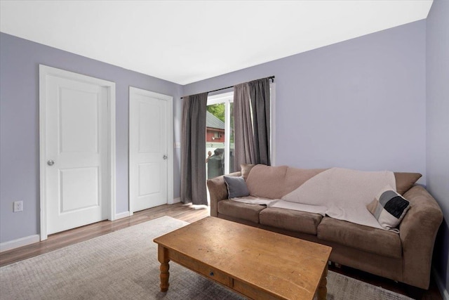 19 Overland St, Laconia, NH 03246 - living room with wood finished floors and baseboards