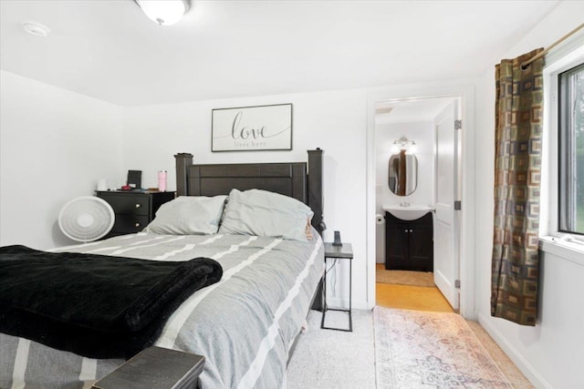 19 Overland St, Laconia, NH 03246 - bedroom featuring a sink, ensuite bath, and baseboards