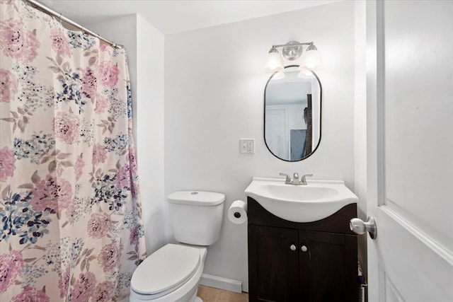 19 Overland St, Laconia, NH 03246 - full bath with vanity, toilet, a shower with shower curtain, and baseboards