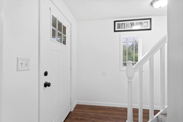 19 Overland St, Laconia, NH 03246 - entrance foyer with stairs, dark wood-style flooring, and baseboards