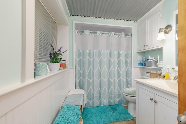 110 Nh Dr, Webster, NH 03303 - bathroom featuring toilet, vanity, a shower with curtain, and wood finished floors