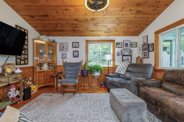 110 Nh Dr, Webster, NH 03303 - living room featuring lofted ceiling, wainscoting, wood ceiling, and wood finished floors
