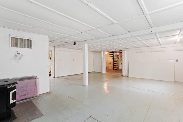 166 New Boston Rd, Goffstown, NH 03045 - garage featuring a wood stove