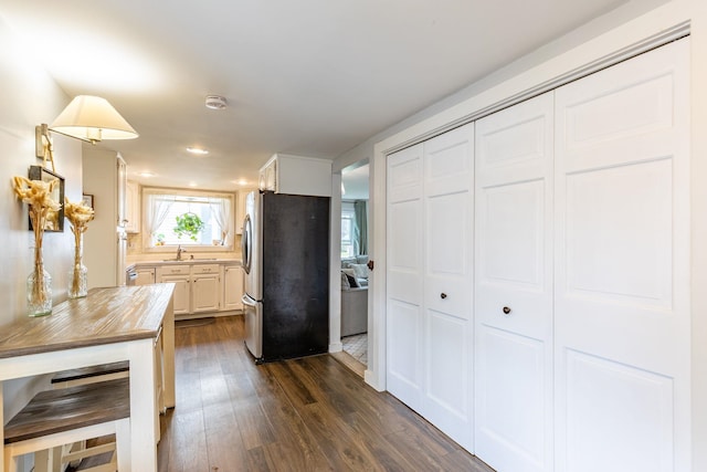 129 Indigo Hill Rd, Somersworth, NH 03878 - kitchen with freestanding refrigerator, wooden counters, dark wood-style flooring, white cabinets, and a sink