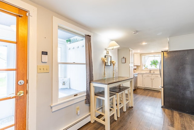 129 Indigo Hill Rd, Somersworth, NH 03878 - kitchen featuring stainless steel appliances, a sink, white cabinetry, dark wood-type flooring, and recessed lighting